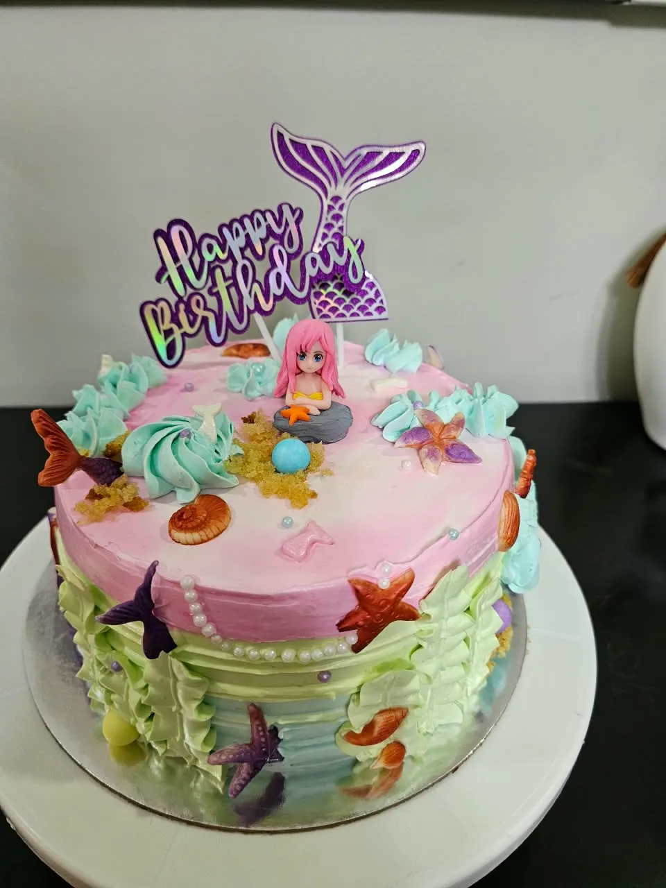Pink and teal mermaid-themed eggless birthday cake